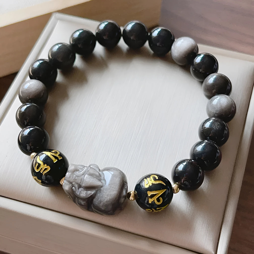 Men's silver stone bracelet with engraved zodiac and proverb designs on beaded surface