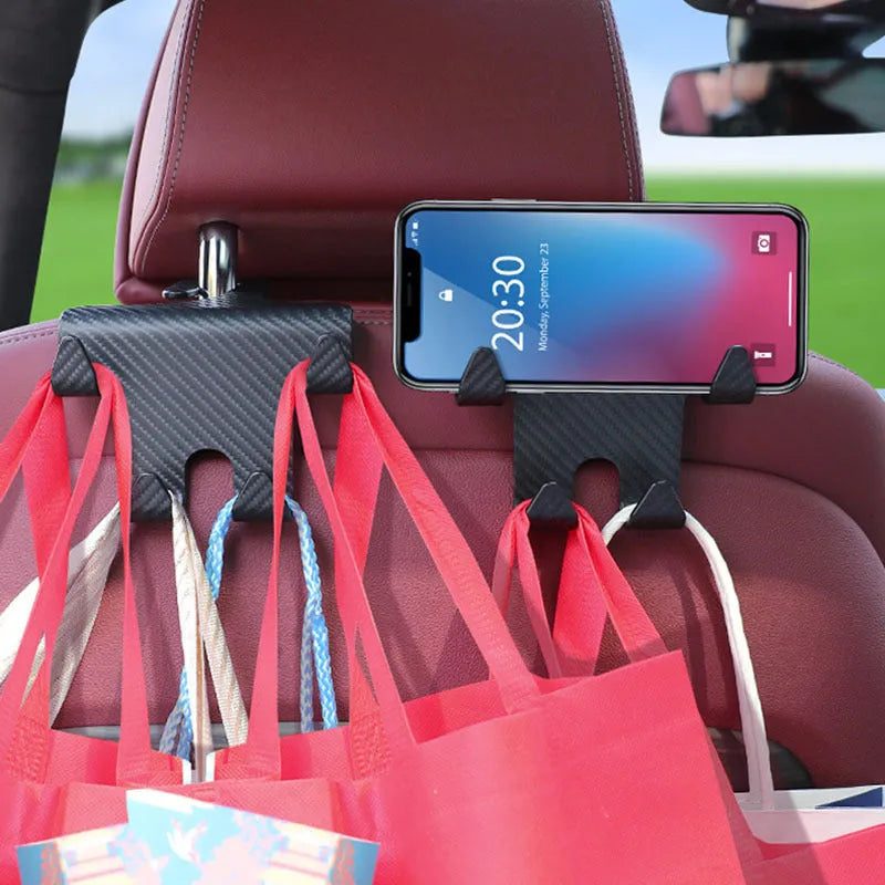 Black ABS plastic car multifunction hook bracket with integrated mobile phone holder for rear seat mounting.