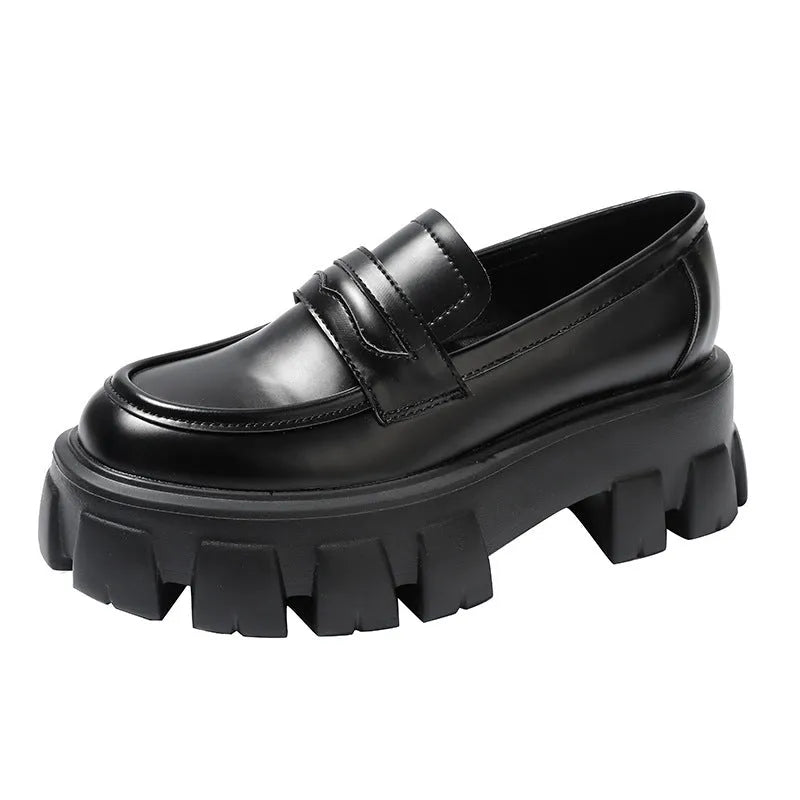 A pair of wide fit leather loafers in a slip-on style with a rubber sole, shown in a choice of finishes.