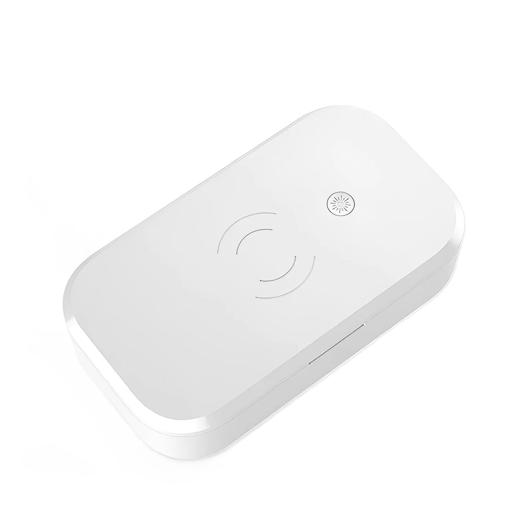 Compact white ultraviolet disinfection box with wireless charging surface for mobile phones
