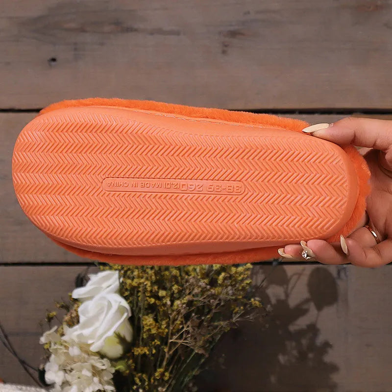 Orange Halloween pumpkin slippers with coral velvet upper and plush lining on non-slip PVC soles