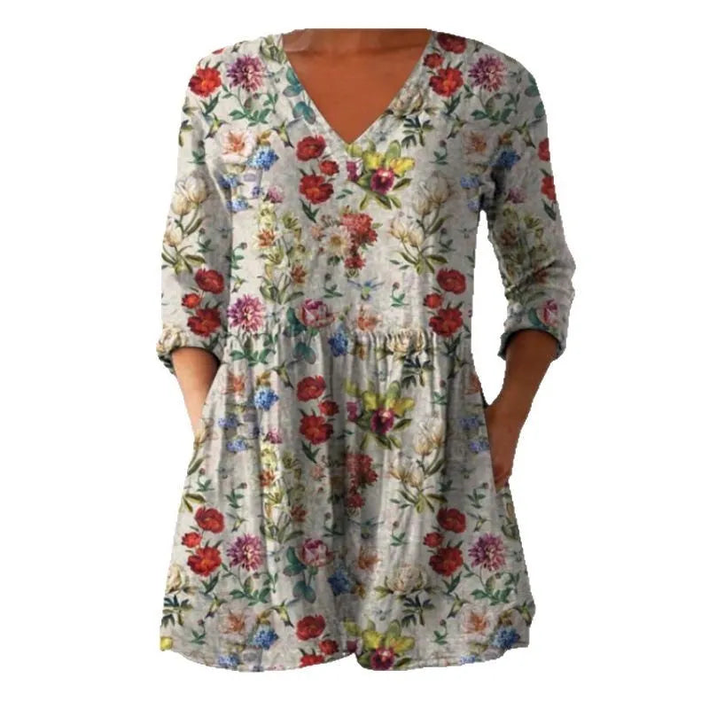 Women's printed loose wave dress with wide waist and three-quarter sleeves in a floral pattern.