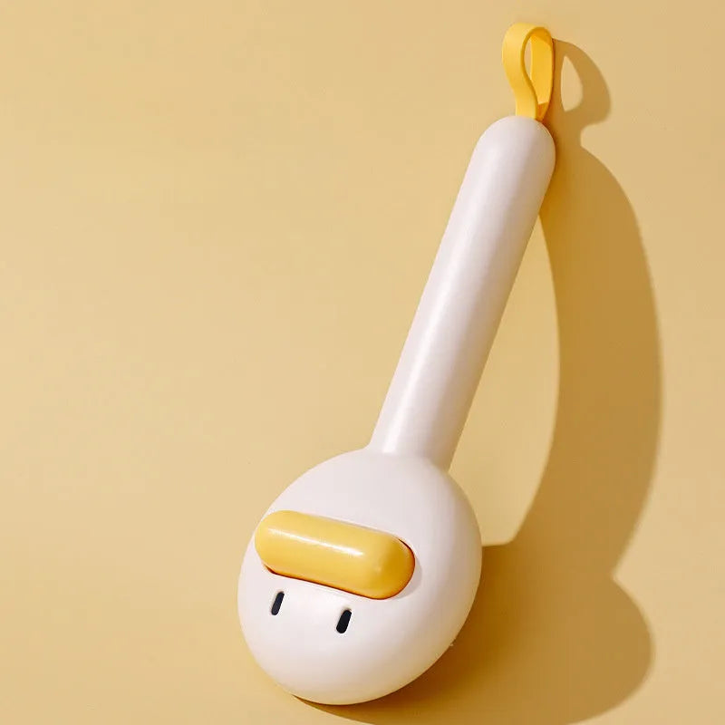 Small yellow duck-shaped pet grooming comb with open section design for cat and dog hair removal