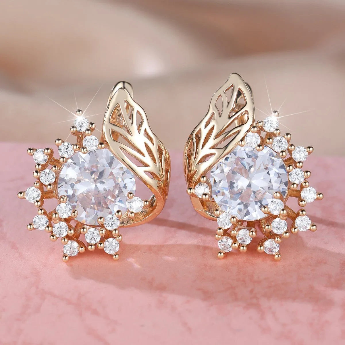Round floral earrings with feather detailing and coloured zircon stones in champagne gold finish