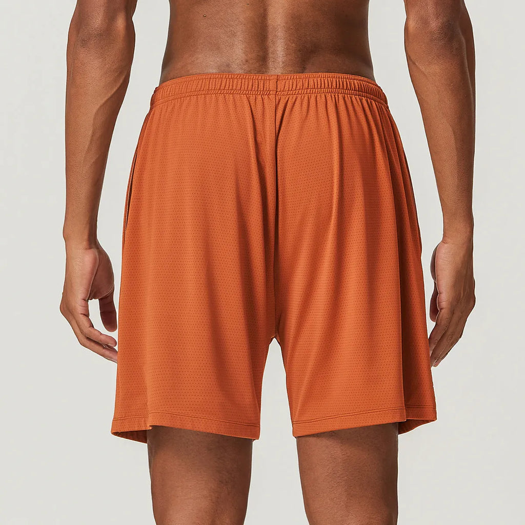 Men's double-layer running shorts in sky green, showing mid-waist fit and shorts length.