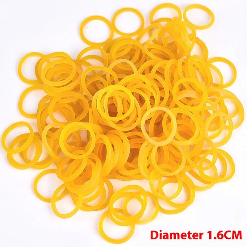 Assortment of bright yellow rubber bands in various sizes from a 500g pack.