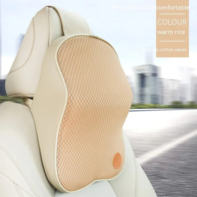Black and brown memory foam car headrest and lumbar support pillows on a car seat.