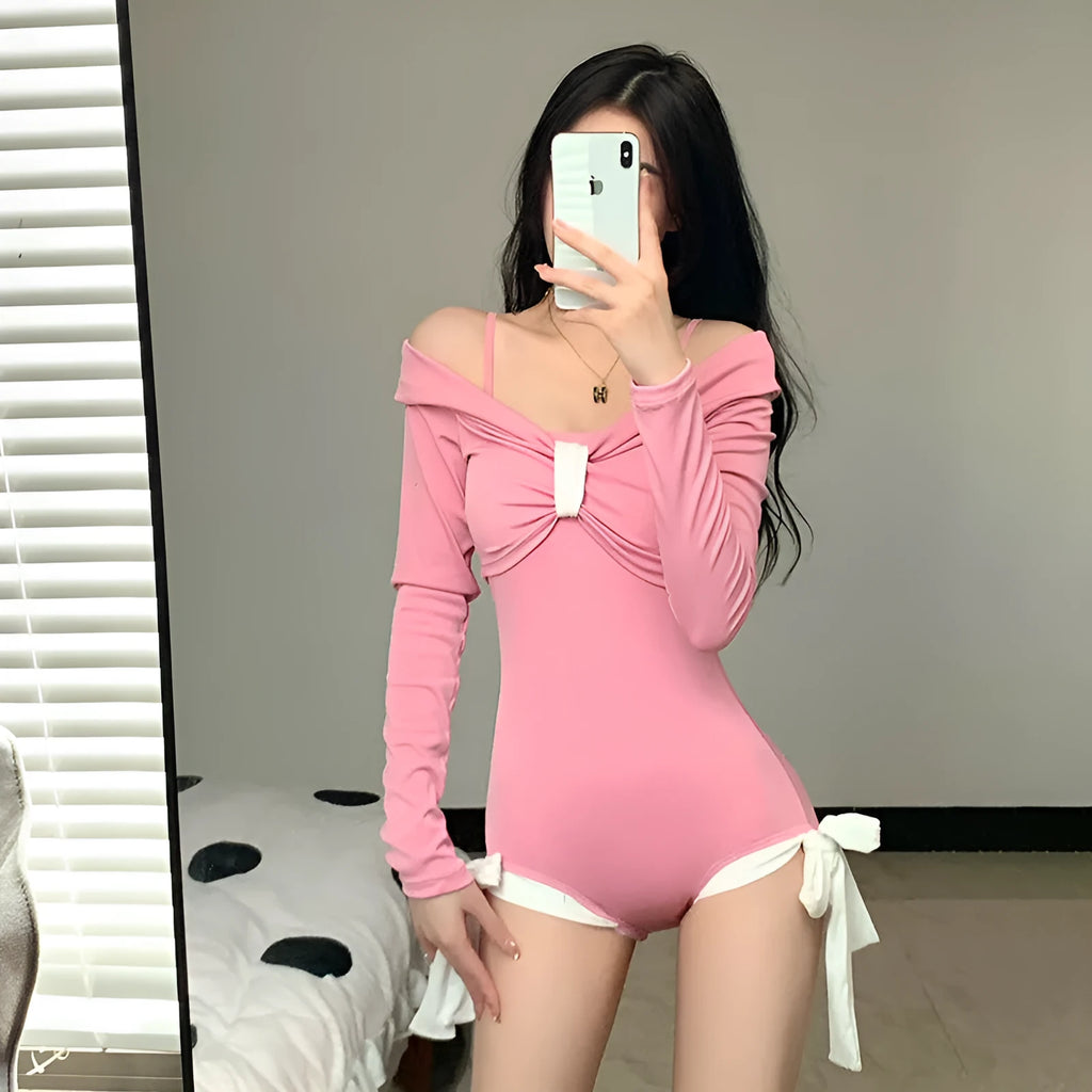Women's long-sleeve one-piece swimsuit in pink and black colours