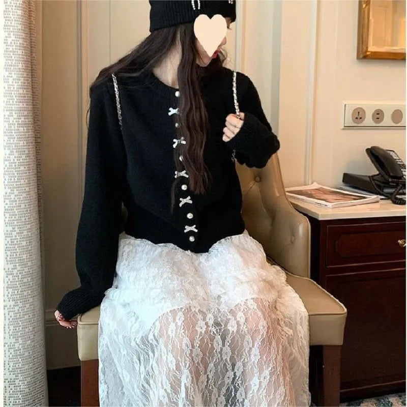 Women's acrylic cashmere cardigan sweater with bow and pearl button detail in nine colour options