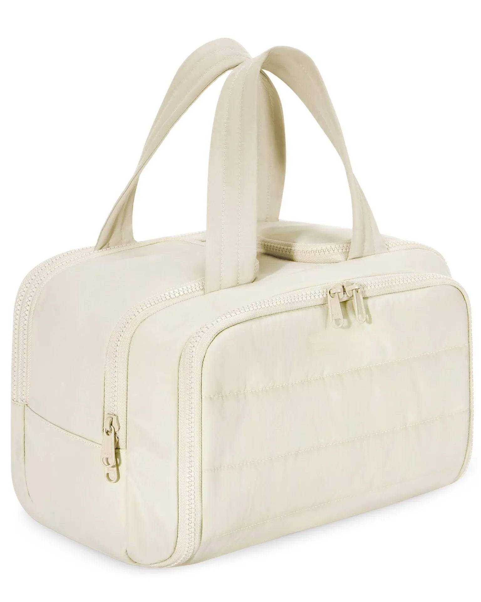 Large lightweight travel toiletry bag in beige with wide open design showing fluffy interior