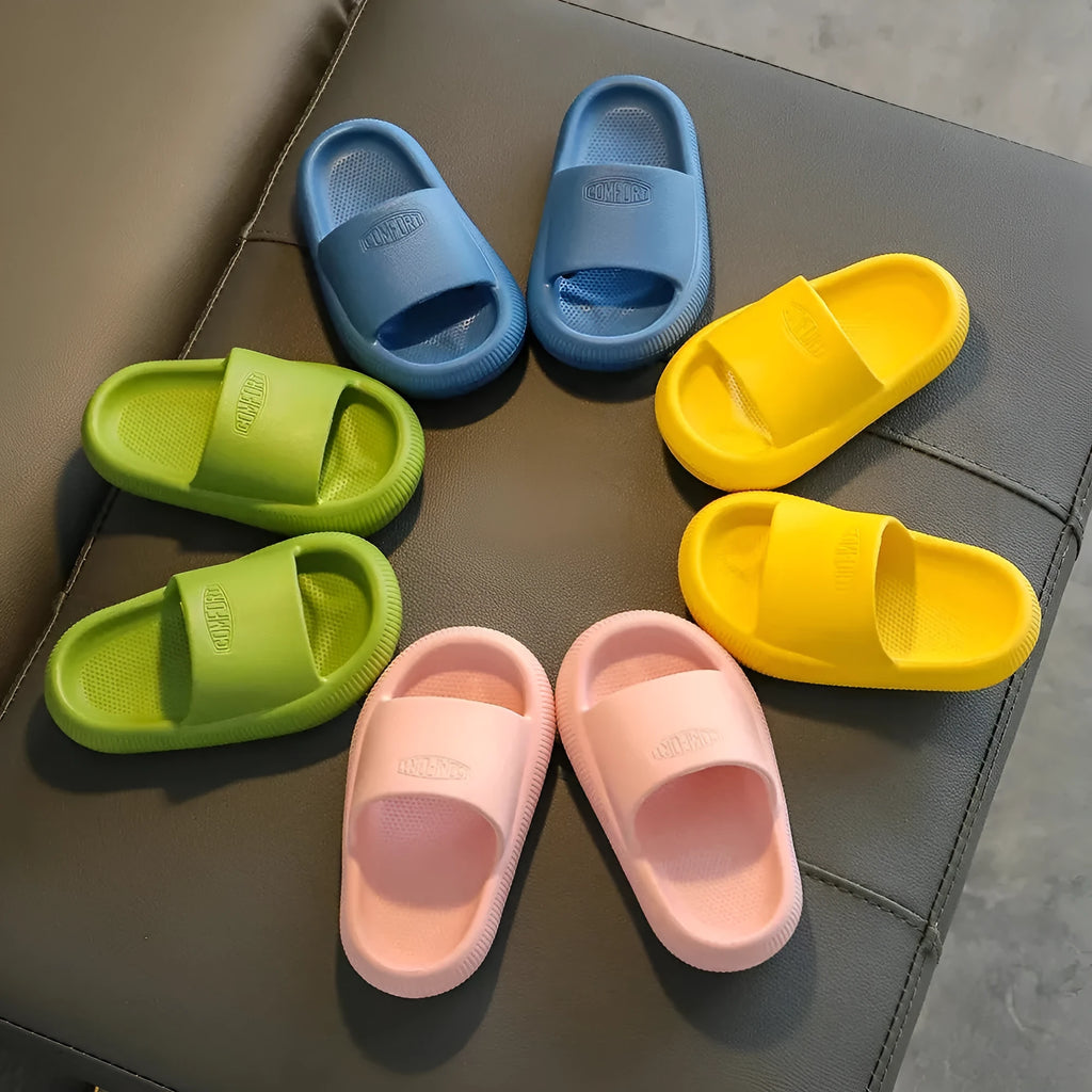 Children's mixed colour EVA slippers with non-slip soles showing size options from 15.5cm to 21.5cm