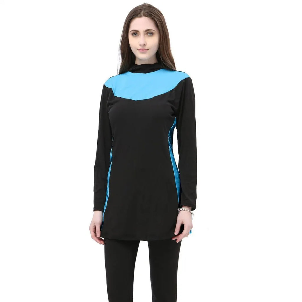 Women's black long sleeve hooded swimsuit with separate pants, shown on a model.