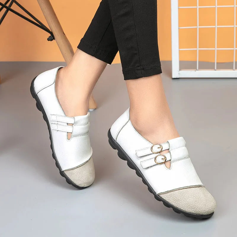 Men's brown leather casual flat shoes with Velcro strap, shown on a white background.