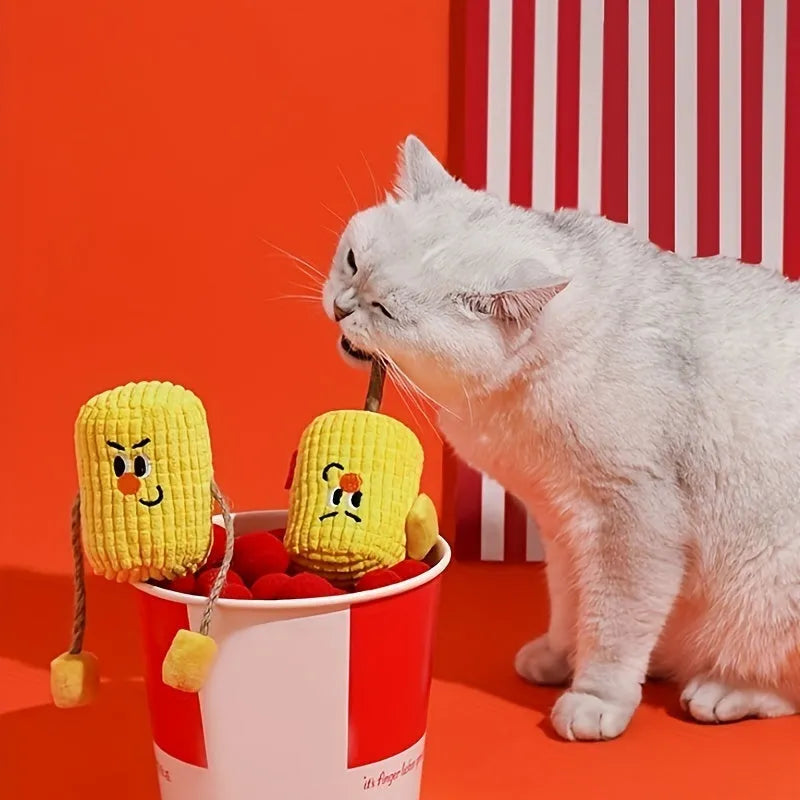 A corn cob shaped chew toy for cats made from polished beech wood, shown next to a tape measure indicating its 15cm length.