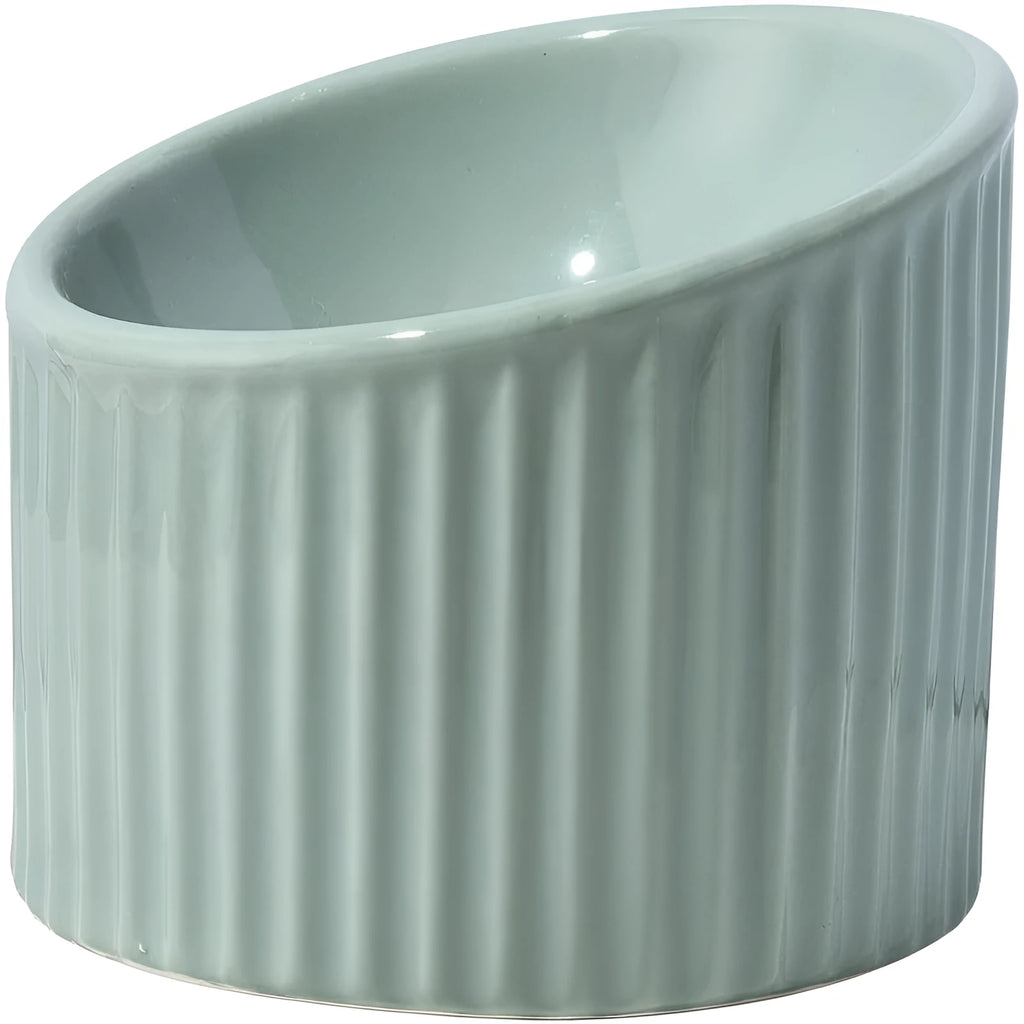 A dark green round ceramic cat bowl elevated on a base, shown at an angle.