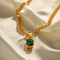 Gold electroplated titanium steel necklace with geometric emerald zircon pendant on Cuban link chain