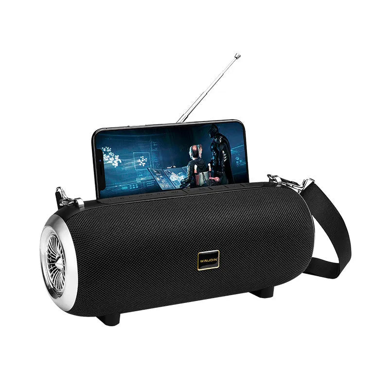 F666 square portable Bluetooth speaker with fabric mesh front, shoulder strap, and FM antenna.