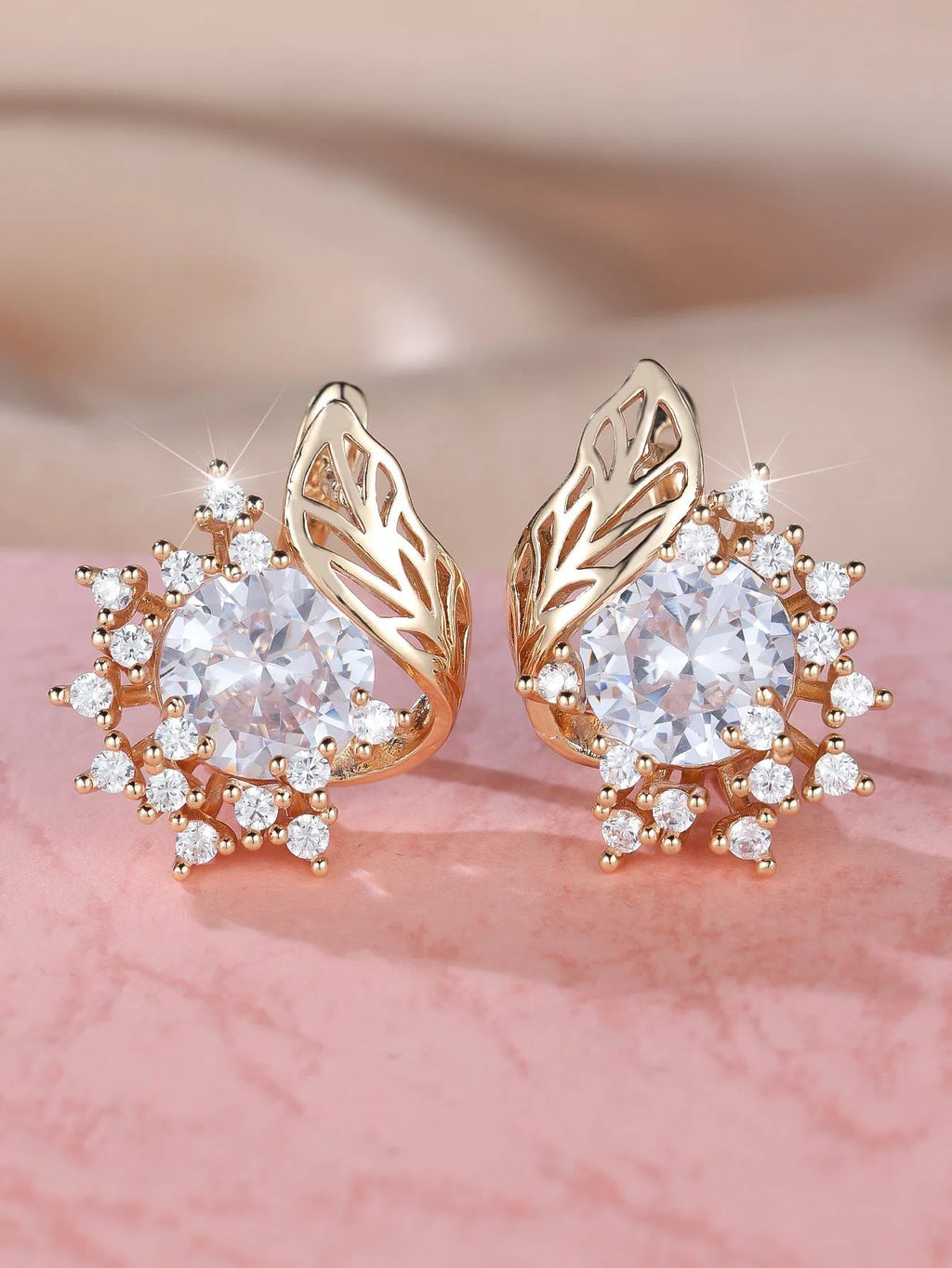 Round floral earrings with feather detailing and coloured zircon stones in champagne gold finish