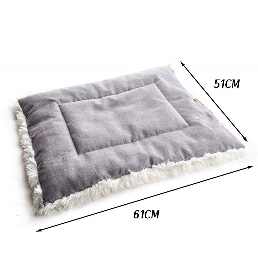 Grey and white long plush pet bed with black non-slip bottom particles