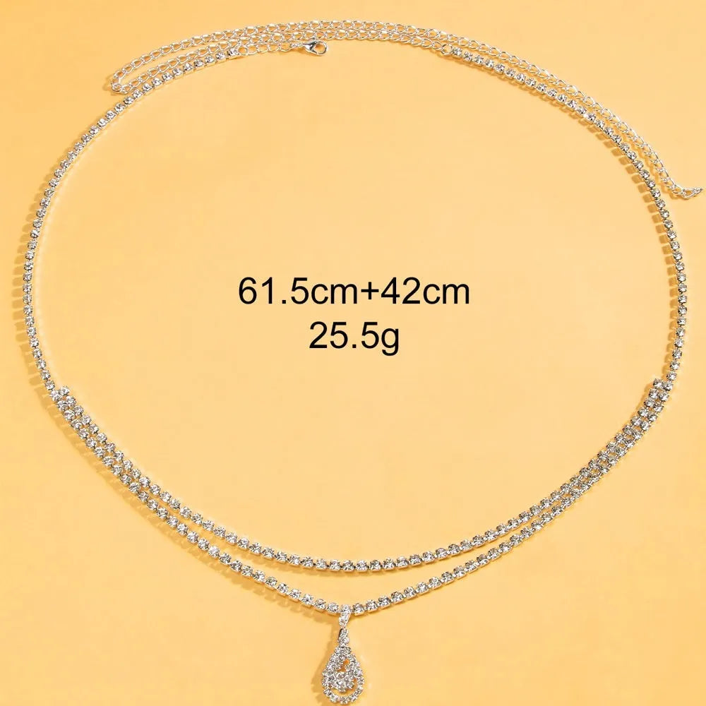 Gold or silver waist chain with water drop pendant and tassel elements, 115cm length with lobster clasp closure