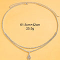 Gold or silver waist chain with water drop pendant and tassel elements, 115cm length with lobster clasp closure