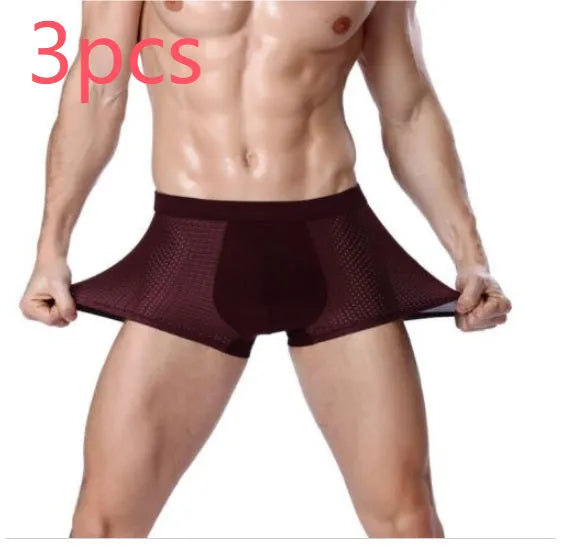 Men's solid colour modal boxer briefs with a U-convex design on a mid-waist.