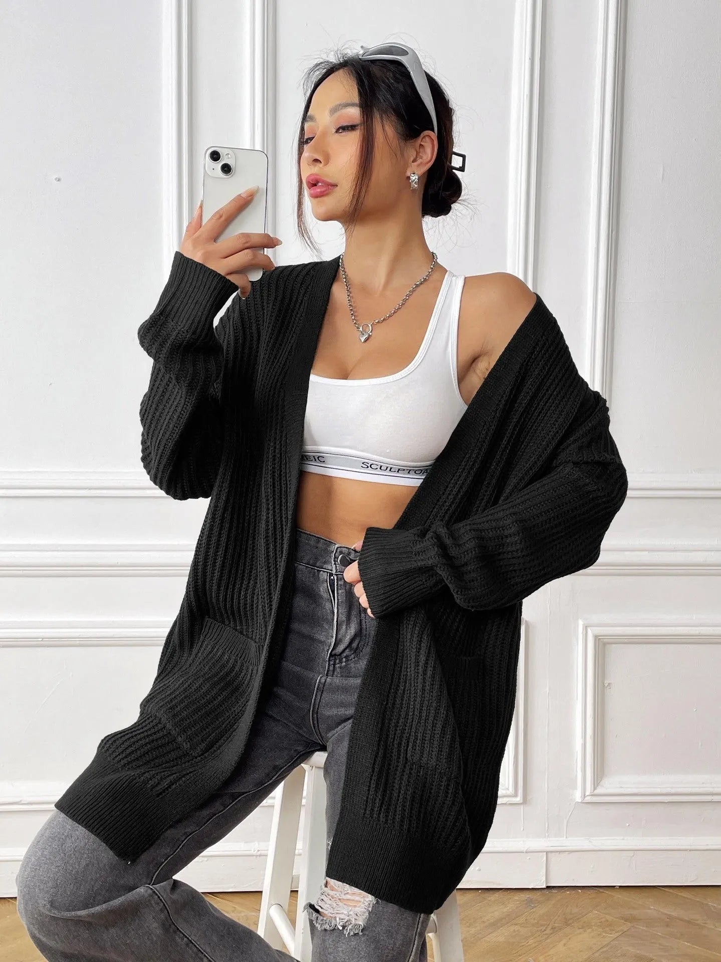 Women's double pocket casual cardigan sweater in dark green, loose mid-length fit.
