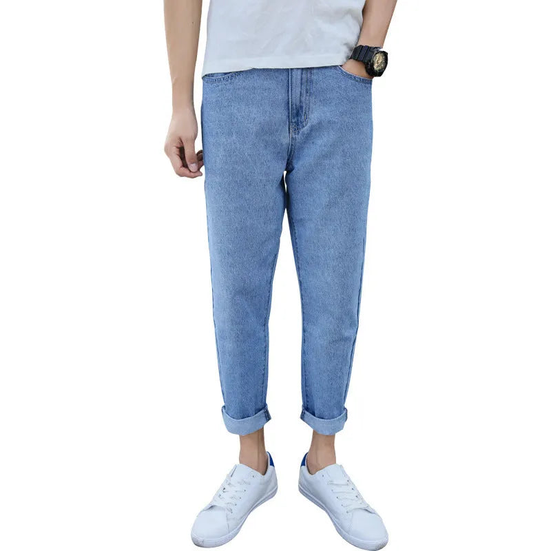 Men's loose straight leg harem jeans in black cotton denim with light straight leg opening