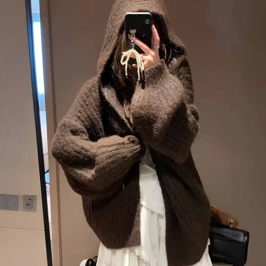 A woman's dark grey hooded cardigan with long sleeves, shown open in a loose fit.