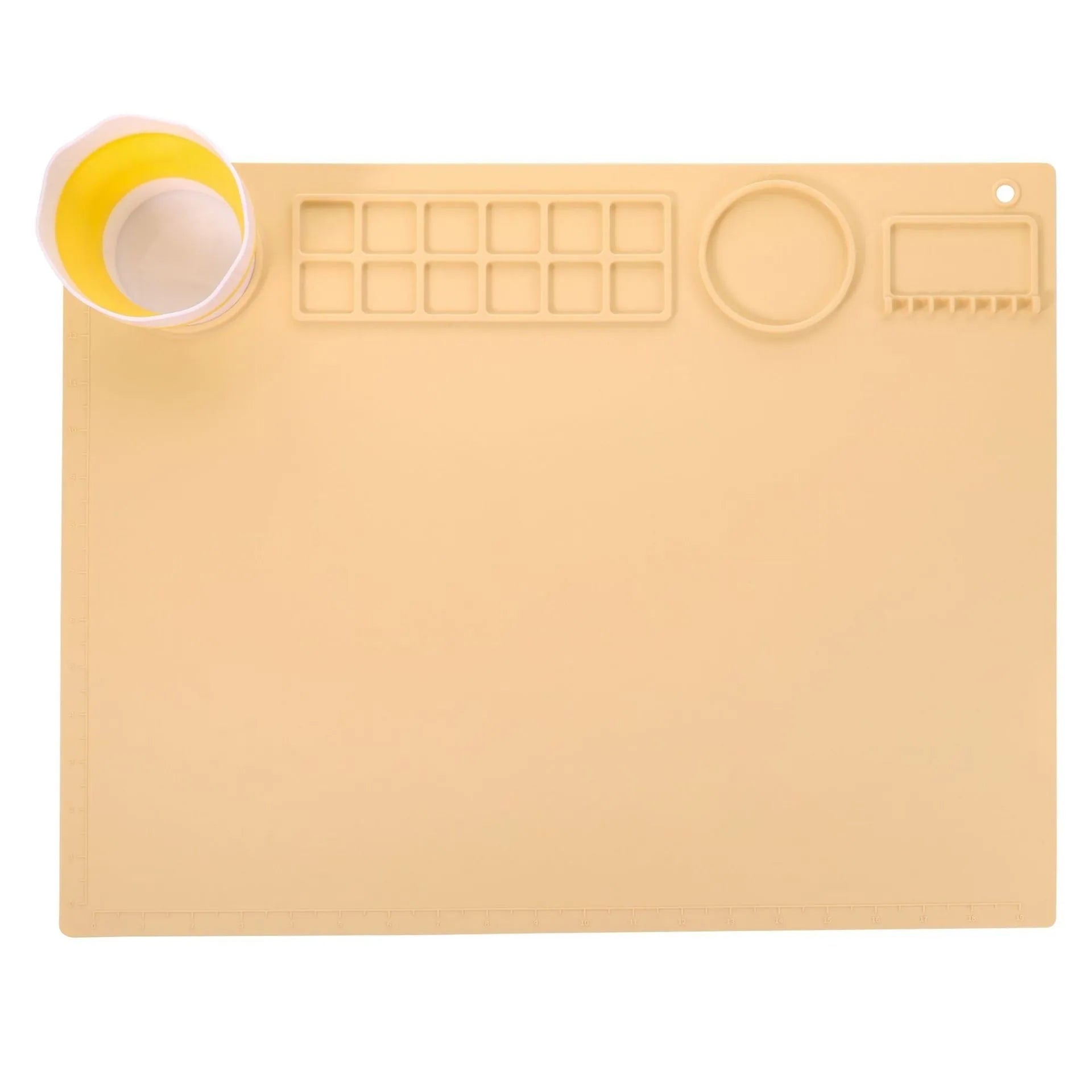 Light blue silicone painting mat with two round bowl compartments, measuring 50 by 40 cm.