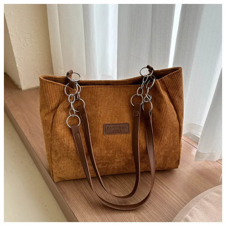 Corduroy one-shoulder tote handbag in street style with three-dimensional pocket