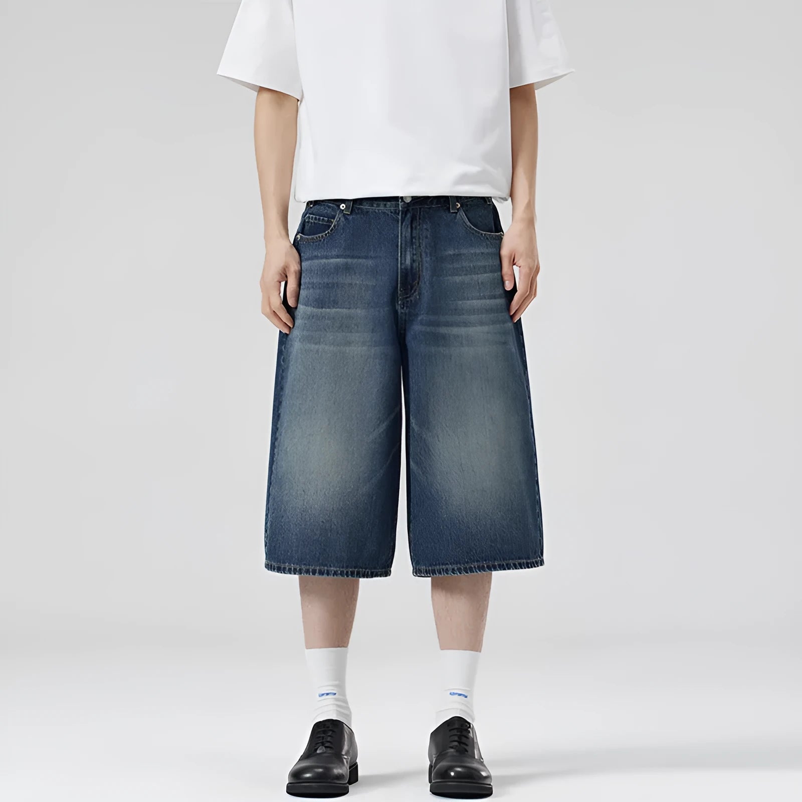 Men's straight-leg cotton denim shorts in cropped length on a casual model