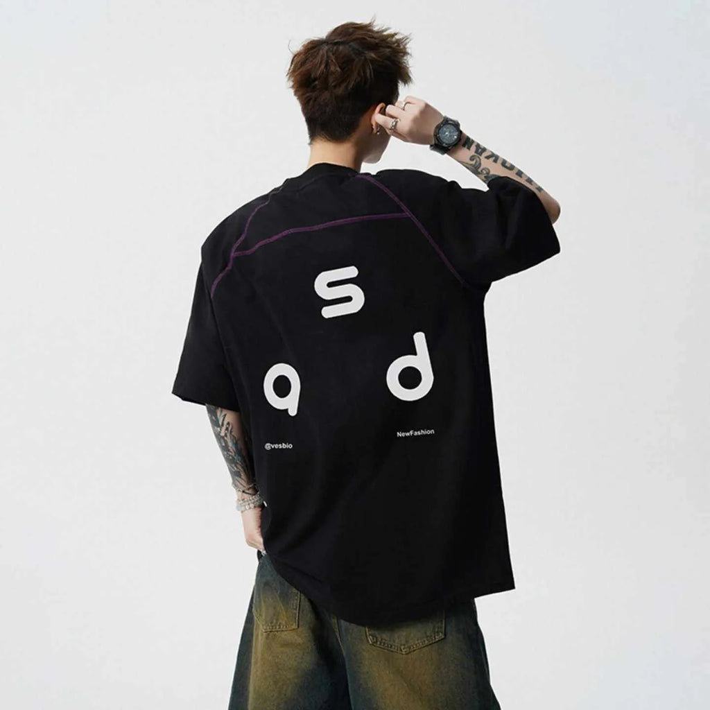Loose fit black cotton t-shirt with a white letter print design on the front.