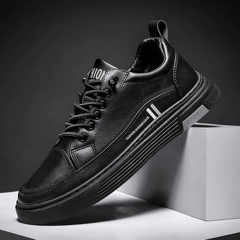 Men's white and black low-top skate shoes with elastic band and microfiber upper.
