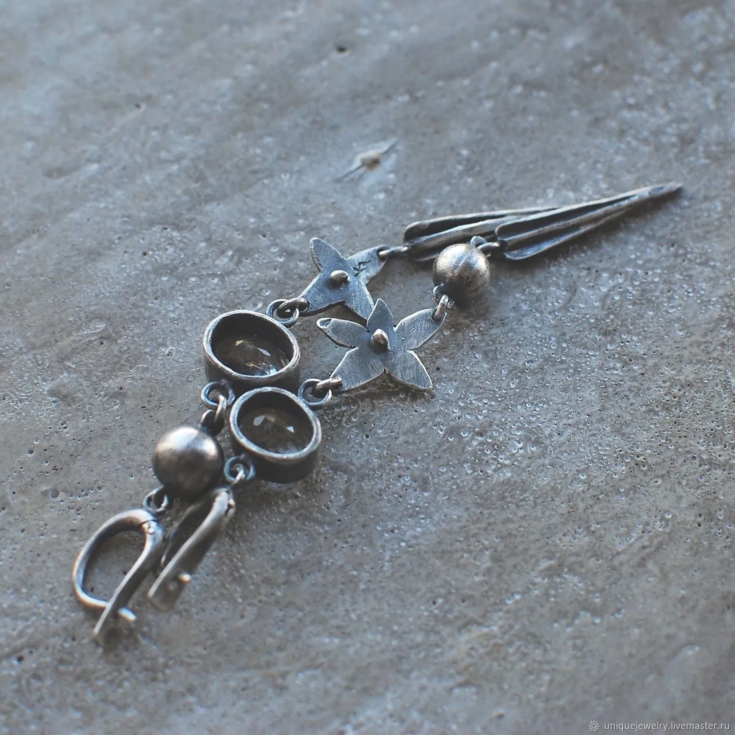Pair of long geometric pendant earrings with rhinestones in antique silver colour