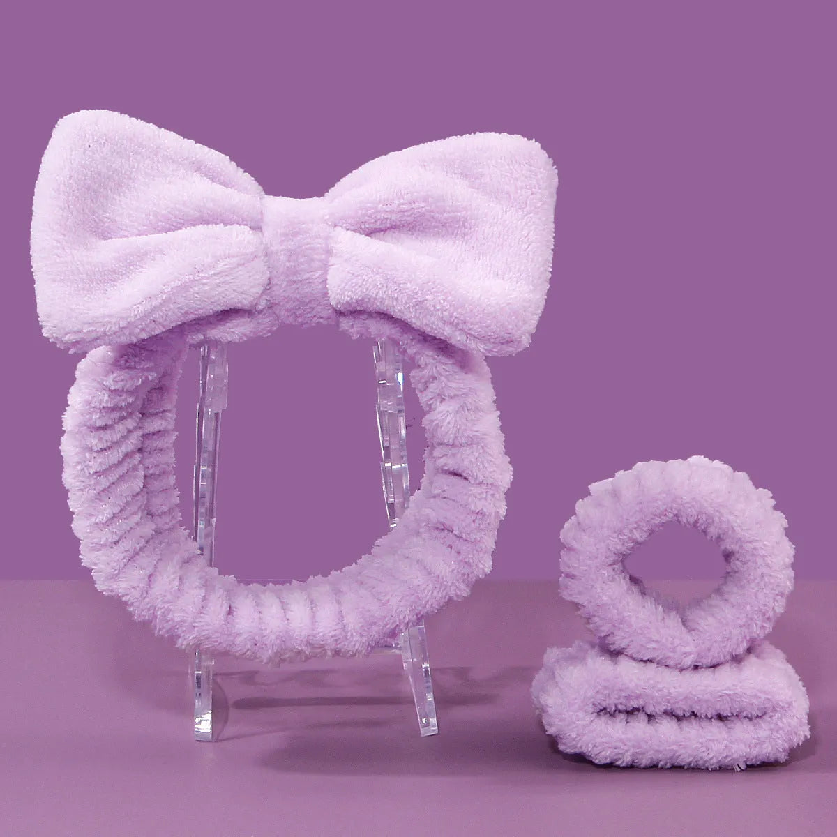 Facial brush set with coral fleece hair band, absorbent headband, and waterproof shower brush in purple colour