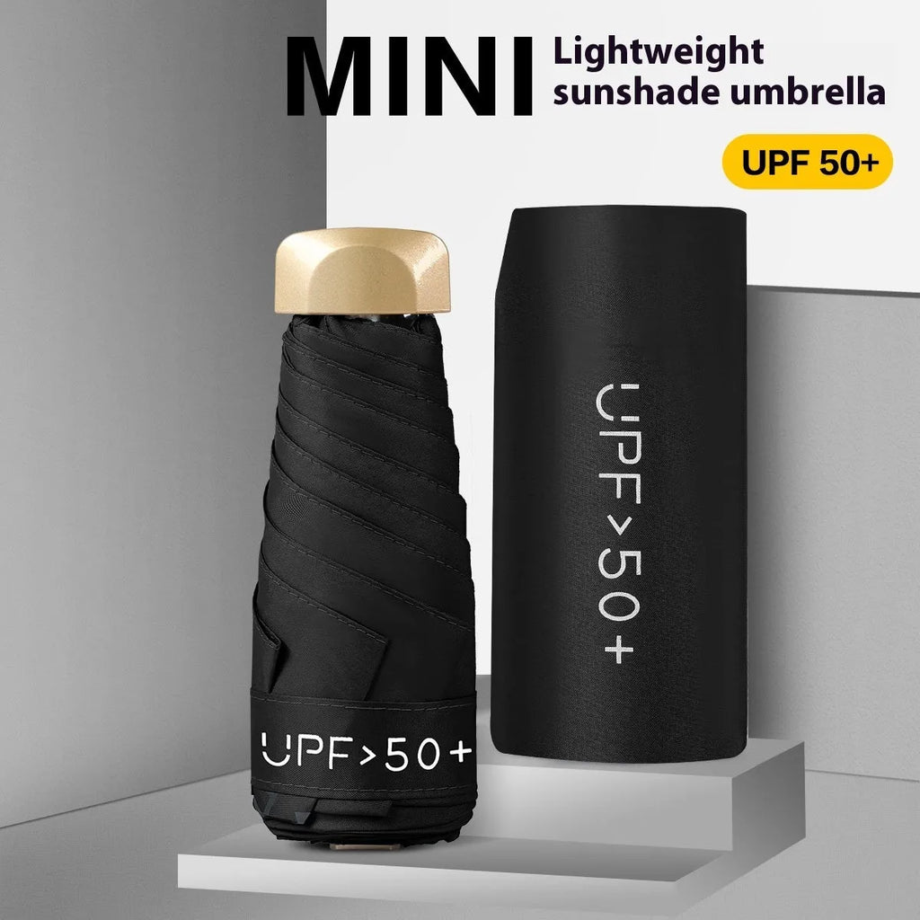Closed five-fold mini pocket sun umbrella with alloy frame and rubber handle, shown in a selection of available colours.