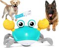 Blue electronic crab dog toy with lights, shown moving sideways on a wooden floor.
