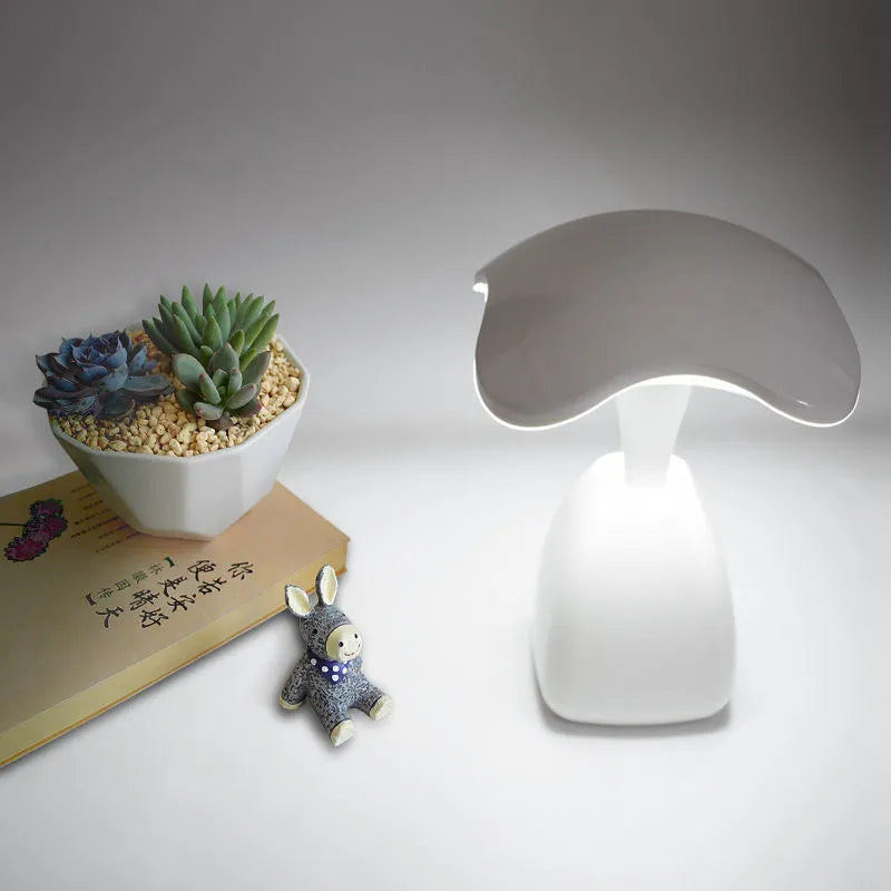 White modern LED desk lamp with plastic shade and touch controls for bedside or desk use