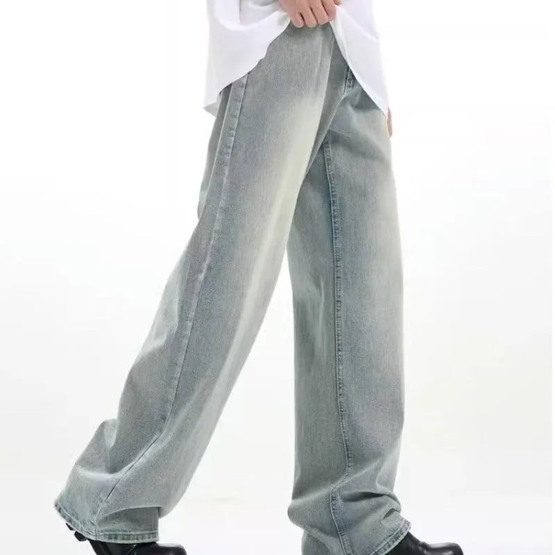 Blue loose-fit retro-style casual trousers with an elastic waistband on a hanger.