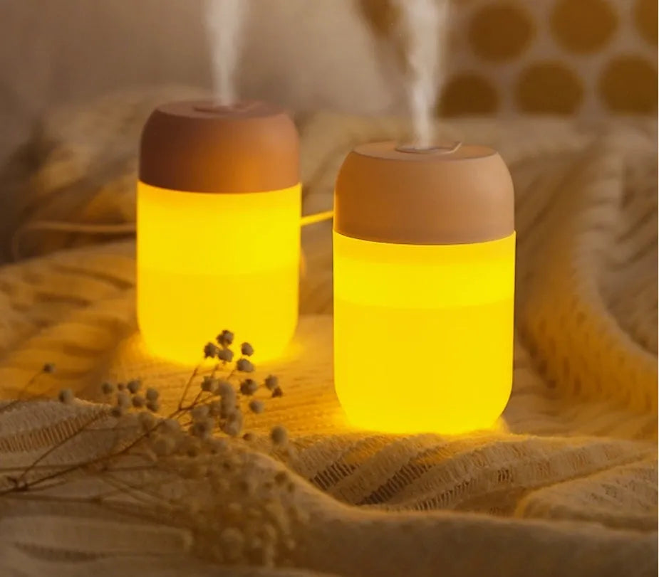 White cylindrical USB-powered humidifier with aromatherapy function on desk