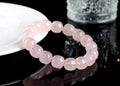 Pink crystal barrel bead bracelet with geometric design for men and women.