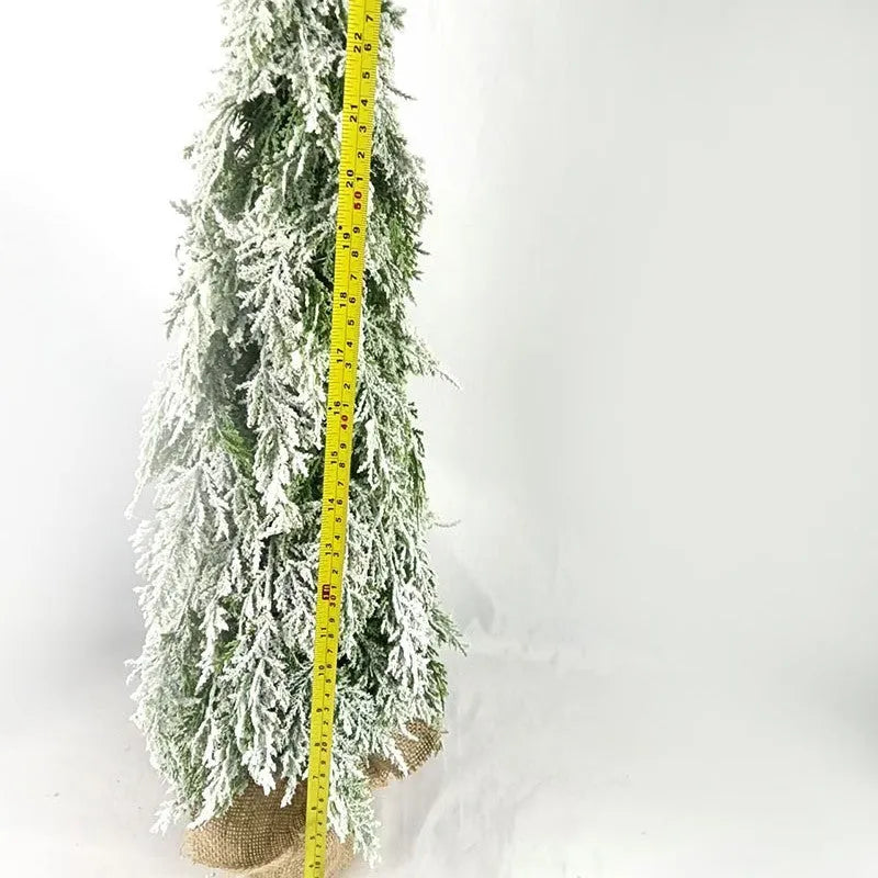 24-inch artificial Christmas tree with white snow finish and built-in LED lights on branches
