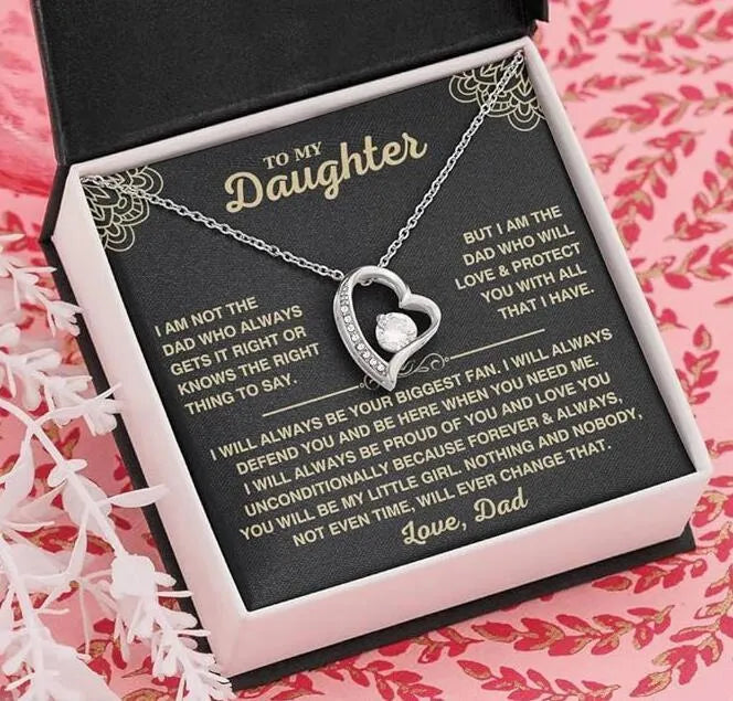Gold hollow heart pendant necklace presented in an open flip gift box with a card.