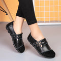 Men's brown leather casual flat shoes with Velcro strap, shown on a white background.