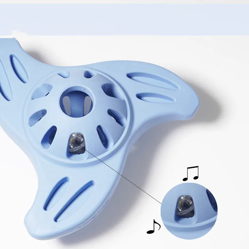 Blue bite-resistant boomerang-shaped dog toy with molar texture on a white background.