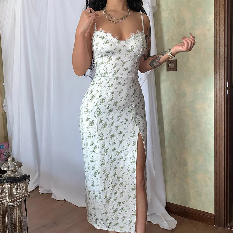 Women's long blue dress with lace flower print and slit suspender design.