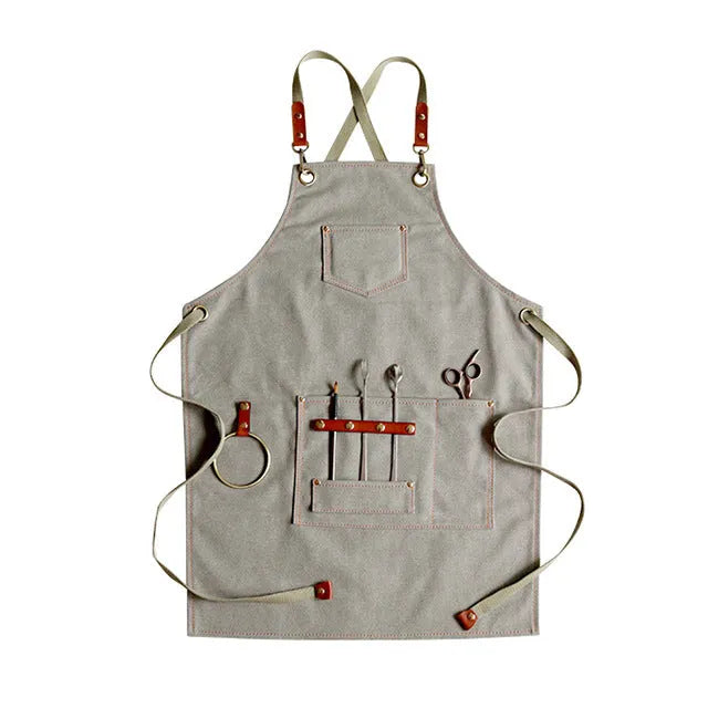 Canvas apron with cross back straps in camel colour for cafe and baking workwear
