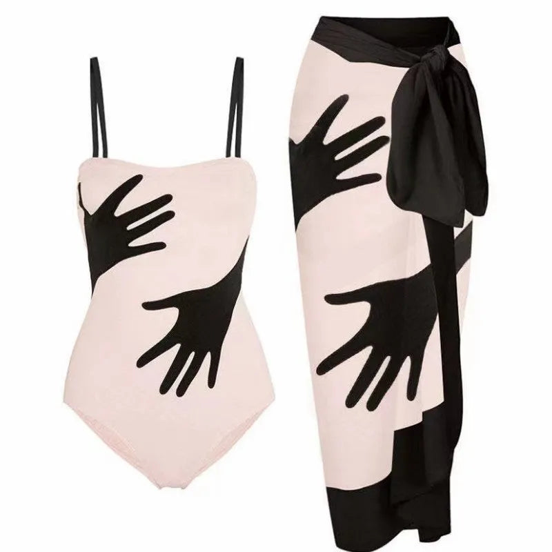 Women's one-piece bikini swimsuit with a light gauze skirt attached, shown on a model.