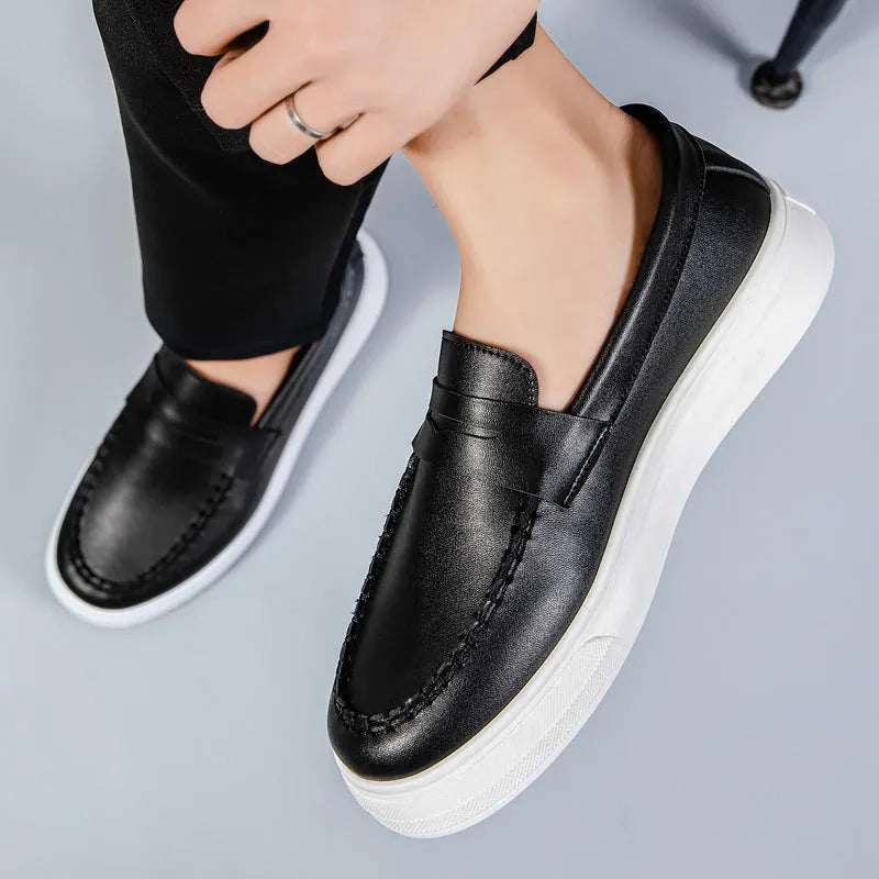Men's white PU leather slip-on loafers with round toe on a solid background.